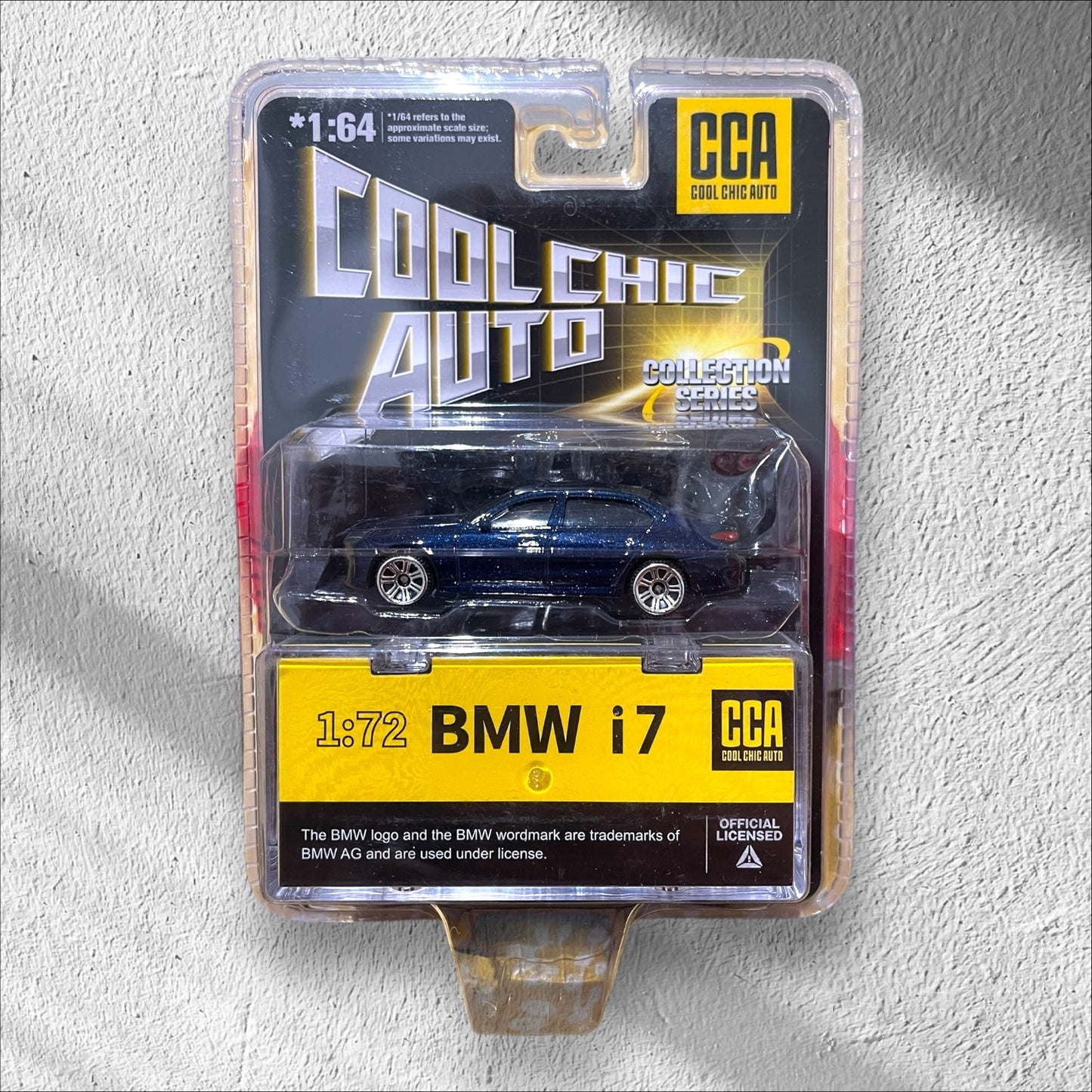 CCA - 1:64 - Premium - BMW i7 - Dark Blue Metallic, Blister Pack (With Stackable Box)